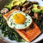 Pan-Seared Salmon with Sunny Egg, Sautéed Spinach, Mushrooms & Avocado